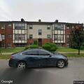 Person banging on apartment door and window