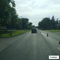 Person walking in roadway on Main Street