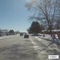 Blue SUV with flat tire blocking traffic