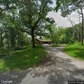 Smoldering tree reported on School Section Lake Drive