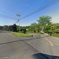 Stop sign knocked down by tractor trailer
