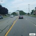 Unknown woman taking photos of vehicle on Porter Ave