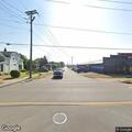 Car hits pole with fluid leak reported