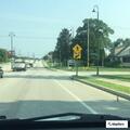 Caller reports prior crash damage at Wales and Main