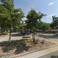 Two men fighting near gazebo on Bank Street