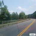 Disabled car with flat tire on highway curve