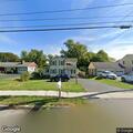 Loose wire hanging from pole on Jamesville Road