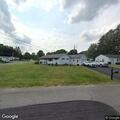 Person experiencing abdominal pain near Camillus