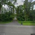 Motorcycle crash into woods on Wood Lane