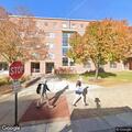 Agitated man throwing trash near Watson Hall dumpsters