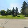Car overturns in driveway on Imlay City Road