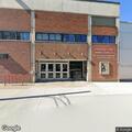 Intoxicated person knocking on theater glass door