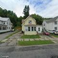 Small rekindle fire behind Spring Street home