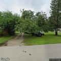 Neighbor pounding on door and screaming outside