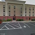 Woman reports being hit with bat in hotel room
