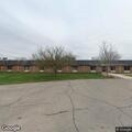 Person falls from standing, reports hip pain in care facility