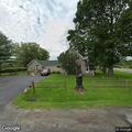 Car leaves road and knocks down wires in field