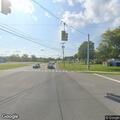 Woman in her fifties found slumped over on roadside