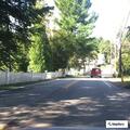 Cars parked on sidewalk at Pepperell Whipple Bridge