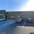 Officers check vehicle and person behind restaurant