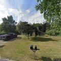 Unoccupied vehicle fire spreads to tree by house