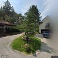 Parked vehicle hit in driveway and driver left