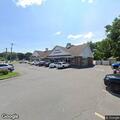 Officer checks vehicle in parking lot