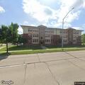 Person lies outside building then walks upstairs at Wright St