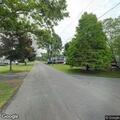 Person experiencing abdominal pain on Lawrence Ave