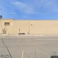 Vehicle hits curb and light pole in parking lot