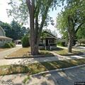 Tree knocks power line onto house at Elmwood Street