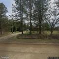 Grass fire near house on North Oak Road