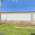 Open garage door found at business, building clear