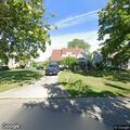 Elderly woman trying to enter house on Irving St