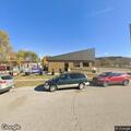 Elderly woman unresponsive but breathing at local cafe