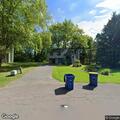 Car backs into neighbor’s utility box and yard