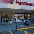 Partially clothed man running near hardware store
