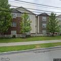 Man stumbling near parking lot at senior apartments