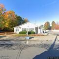 Vehicle hits post office building in Northville