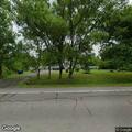 Tree leaning over road may fall on passing cars