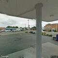 Man in wheelchair on sidewalk outside Ransomville store