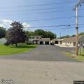 Elderly woman searching for lost phone at house
