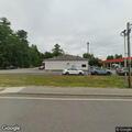 Woman removed from gas station property