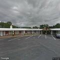Woman struggling to walk near Landmark Motor Inn