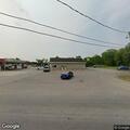 Abandoned pickup left at Circle K gas pumps