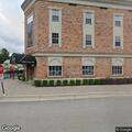Male passes out at theater door; call later disregarded