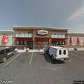 Man jumping on tables outside Queensbury store