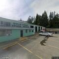 Burglary in progress; suspect possibly armed, white pickup at repair shop