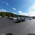 Officers check vehicles loitering behind store
