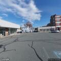 Man possibly under influence dancing in parking lot